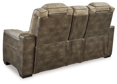 Ashley Furniture Next-Gen DuraPella power reclining loveseat with built-in console, shown from the back with plush upholstery.
