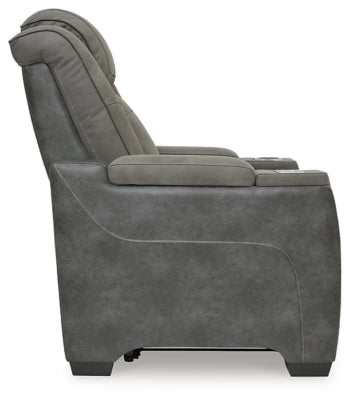 Ashley Furniture Next-Gen DuraPella power recliner with plush fabric and padded armrests, shown from a side angle.