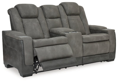 Ashley Furniture Next-Gen DuraPella power reclining loveseat with console, shown open with plush cushions and modern design.