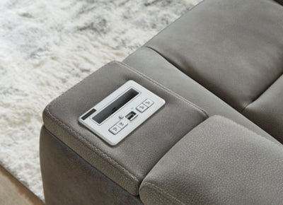 Ashley Furniture Next-Gen DuraPella power recliner with control panel and plush upholstery in a modern living room setting.