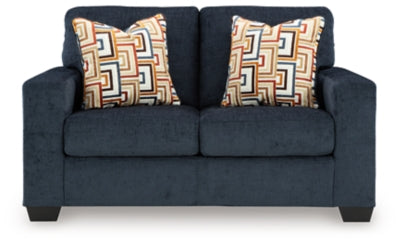 Ashley Furniture Aviemore loveseat with plush upholstery and curved armrests, shown from a head-on view.