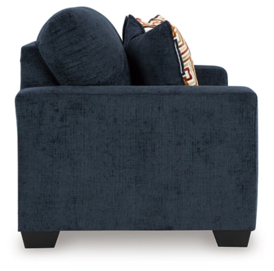 Ashley Furniture Aviemore loveseat with plush fabric, featuring soft cushions and stylish armrests, ideal for cozy living room seating.