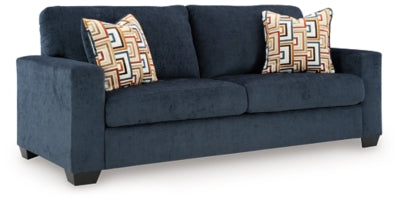Ashley Furniture Aviemore sofa shown from an angle, featuring plush cushions and a modern design in a cozy living room setting.