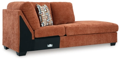 Ashley Furniture Aviemore sectional with chaise, showing a modern fabric sofa in a cozy living room setting.