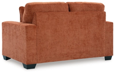 Ashley Furniture Aviemore loveseat with plush fabric and cushioned back, perfect for cozy living room seating.