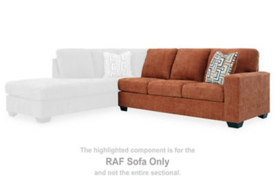 Ashley Furniture Aviemore sectional with chaise, featuring plush cushions and a modern design, shown in a cozy living room setting.