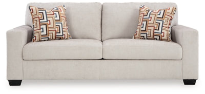 Ashley Furniture Aviemore Sofa with beige fabric and plush cushions, front view showing comfortable seating and stylish design.