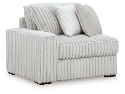 Ashley Furniture Stupendous sectional sofa with plush cushions and modern design, shown from an angled perspective.