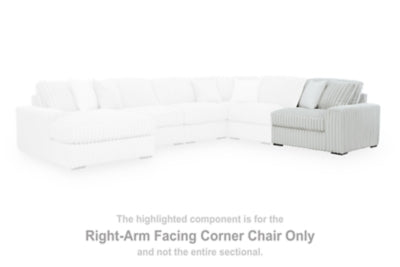 Ashley Furniture Stupendous sectional sofa with plush cushions and modern design, shown in a spacious living room setting.