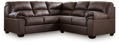Ashley Furniture WillowBend sectional in neutral fabric with plush cushions and wide armrests, shown in a modern living room setting.