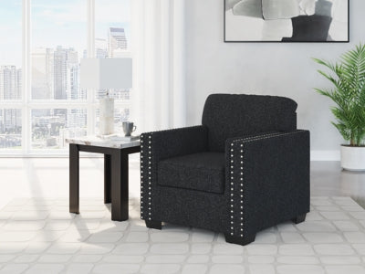 Ashley Furniture Jasmine Peaks Chair with plush fabric upholstery and wooden legs, showcasing a stylish and comfortable seating option.