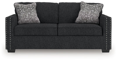 Ashley Furniture Jasmine Peaks sofa with plush cushions and neutral fabric, shown in a head-on view.