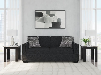 Ashley Furniture Jasmine Peaks Sofa with plush fabric and cushioned armrests, stylishly designed for modern living rooms.