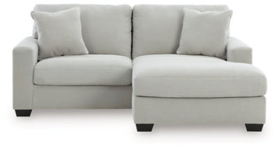 Greenbriar sofa chaise by Ashley Furniture, showing a plush green upholstered sofa with chaise lounge extension.