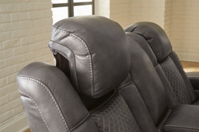 Fyne-Dyme Power Reclining Loveseat with Console by Ashley Furniture, showing plush fabric, reclining mechanism, and built-in cup holders.