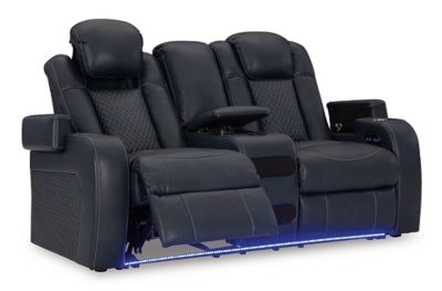 Ashley Furniture Fyne-Dyme power reclining loveseat with console, showing open reclining seats and plush fabric upholstery.