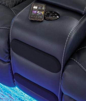 Blue Fyne-Dyme power reclining loveseat with console from Ashley Furniture, featuring Bluetooth audio and plush cushioning.