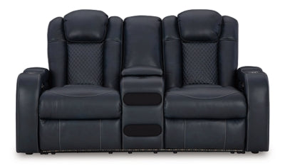 Ashley Furniture Fyne-Dyme Power Reclining Loveseat with Console, shown from head-on view, featuring plush cushions and built-in cup holders.