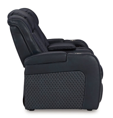 Ashley Furniture Fyne-Dyme Power Reclining Loveseat with Console, showing plush fabric, reclining mechanism, and built-in armrest console.