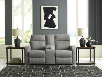 Ashley Furniture Gauntlet reclining loveseat with built-in console, featuring plush upholstery and cup holders for comfort.