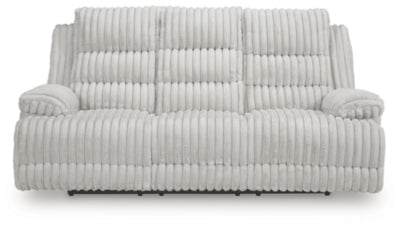 Ashley Furniture Rhines Falls power reclining sofa with drop-down table, showing plush upholstery and built-in console in a cozy living room scene.
