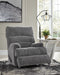 Open Ashley Furniture Man Fort recliner showing plush upholstery and reclining mechanism in a modern living room setting.