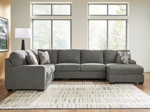 Ashley Furniture Clarington Sleeper Sectional with Chaise, beige fabric, featuring a spacious design and plush cushions.