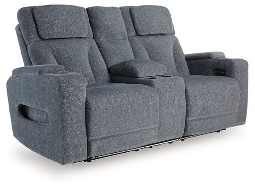 Ashley Furniture Studio Cave power reclining loveseat with built-in console, featuring plush cushions and sleek design, angled view.