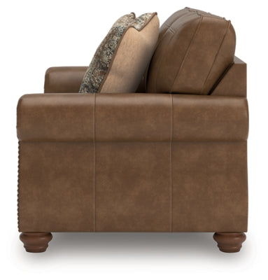 Ashley Furniture Chasemore loveseat with plush fabric and rolled arms, shown in a cozy living room setting.