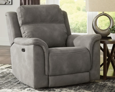 Ashley Furniture Next-Gen DuraPella Power Recliner in dark brown leather with plush cushioning and padded armrests.