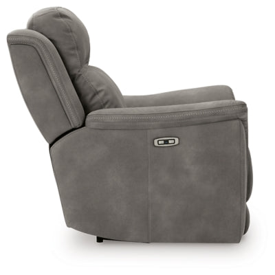 Ashley Furniture Next-Gen DuraPella Power Recliner with plush upholstery and adjustable headrest, shown in a side view.