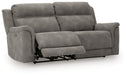 Ashley Furniture Next-Gen DuraPella Power Reclining Sofa with plush upholstery and adjustable reclining seats, shown from an angle.