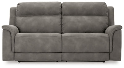 Ashley Furniture Next-Gen DuraPella Power Reclining Sofa with plush cushions and reclining features, shown from a head-on angle.