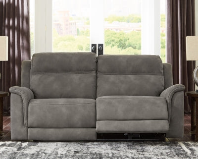 Ashley Furniture Next-Gen DuraPella Power Reclining Sofa with plush cushions and reclining features in a modern living room setting.