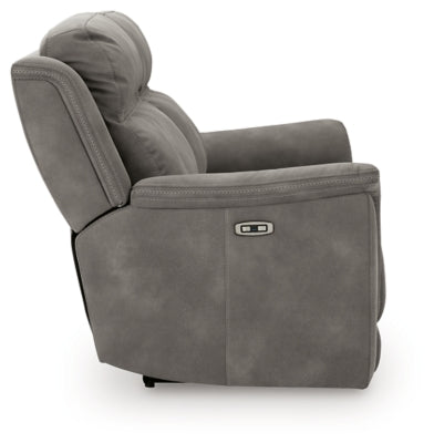 Ashley Furniture Next-Gen DuraPella Power Reclining Sofa with plush cushions and recliner controls, shown from side view.