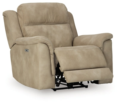Ashley Furniture Next-Gen DuraPella power recliner shown from an angle with the reclined seat open and plush upholstery.