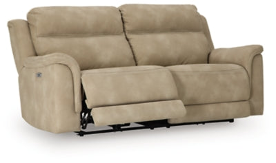 Ashley Furniture Next-Gen DuraPella power reclining sofa shown from an angled open view with plush cushions and reclining features.