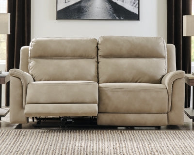 Ashley Furniture Next-Gen DuraPella power reclining sofa with plush cushions and modern design, shown in dark gray fabric.
