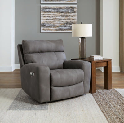 Close-up of Ashley Furniture Next-Gen DuraPella Power Recliner with plush cushioning and dark leather upholstery.