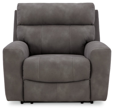 Next-Gen DuraPella power recliner by Ashley Furniture, showing a plush, brown fabric recliner with padded armrests and a high back.