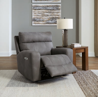 Open Next-Gen DuraPella power recliner by Ashley Furniture showing plush cushioned seat, armrests, and reclining mechanism.