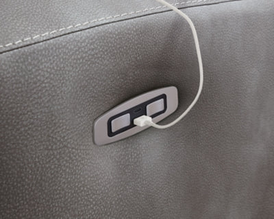 Close-up of the Next-Gen DuraPella Power Recliner by Ashley Furniture, showing plush fabric, reclining mechanism, and USB charging port.