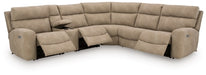 Ashley Furniture Next-Gen DuraPella power reclining sectional with plush cushions and modern design, shown in an open position.