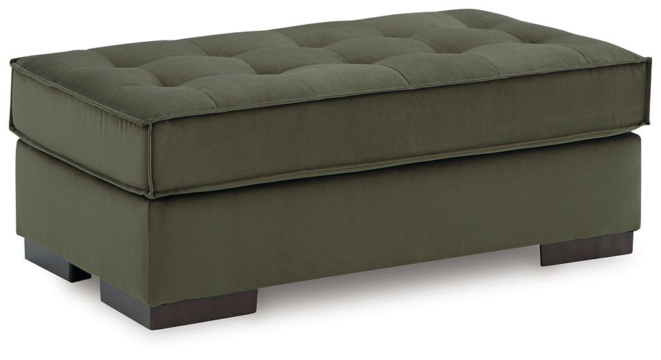 Ashley Furniture Caspian-Town oversized accent ottoman with plush fabric and a modern design, shown from an angled side view.