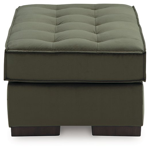 Caspian-Town oversized accent ottoman by Ashley Furniture with beige fabric and tapered wooden legs, shown from side view.