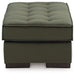 Caspian-Town oversized accent ottoman by Ashley Furniture with beige fabric and tapered wooden legs, shown from side view.