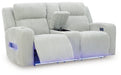 Ashley Furniture Forest Lake power reclining loveseat with console, shown open from an angle, featuring plush fabric and built-in cup holders.