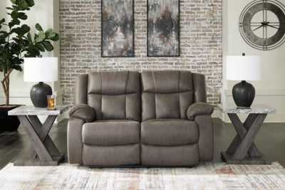 First Base reclining loveseat by Ashley Furniture, showing plush fabric upholstery and built-in recline feature.