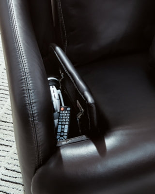 Ashley Furniture Modmax II Swivel Glider Recliner with plush fabric and ergonomic design, shown in a close-up detail shot.