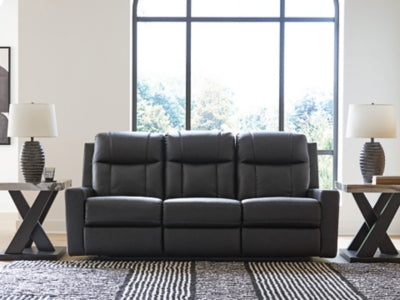 Ashley Furniture Mackmenville reclining sofa with plush cushions and fabric upholstery, shown in a closed position.